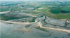 Aerial view of managed realignment at low tide - Photo credit: UK Environment Agency